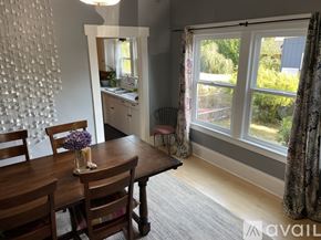 Portland apartment for rent - A dining room with a wooden table and chairs.