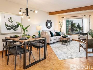 Seattle condo for rent - A living room with a dining table and chairs.