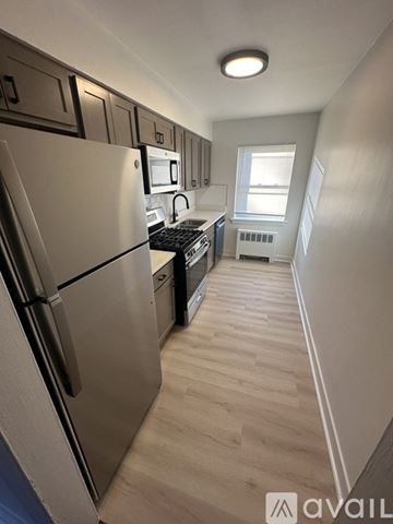 Hammond apartment for rent - A kitchen with a refrigerator, microwave, and oven.