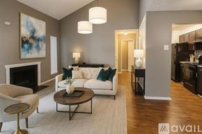 Dallas apartment for rent - A swimming pool surrounded by a stone patio and a building in the background.