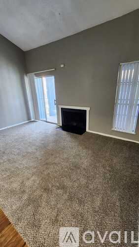 Dallas apartment for rent - A living room with a television and carpeted floor.
