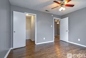 Dallas apartment for rent - A kitchen with black appliances and wooden floors.