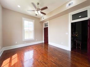 Bay City house for rent - A room with a ceiling fan and a window.