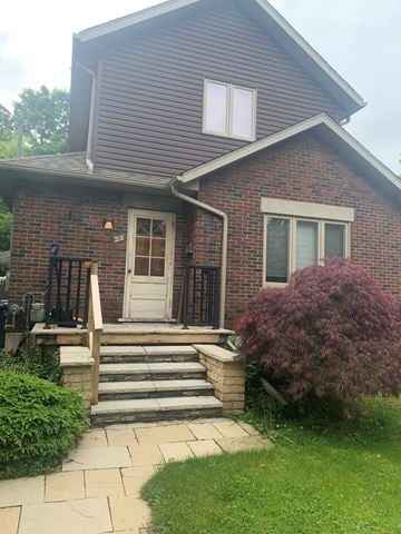 Guelph house for rent - A house with a white door and a small porch.