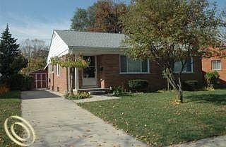 Redford Charter Township house for rent - A house with a white door and a small porch.