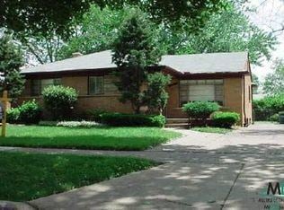 Oak Park house for rent - A house with a brown roof and a green lawn in front.