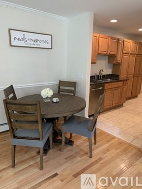 Old Orchard Beach townhouse for rent - A dining room with a table set for four.