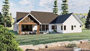 Fort Gibson house for rent - A modern house with a white exterior and a brown roof.