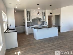 Fort Gibson house for rent - A modern kitchen with a large island in the middle.