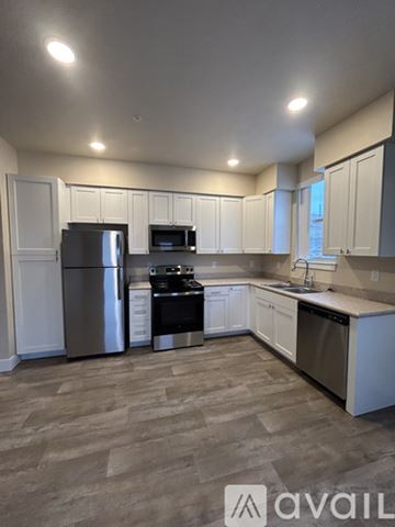 Missoula apartment for rent - A kitchen with white cabinets and stainless steel appliances.