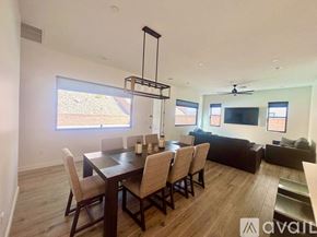 Lake Havasu City house for rent - A modern dining room with a large table and chairs.