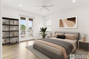 Tampa townhouse for rent - A red door is on the left side of a white house.