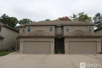 Midland apartment for rent - A two-car garage is attached to a house.