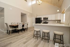 Annandale apartment for rent - A kitchen with wooden cabinets and a marble countertop.