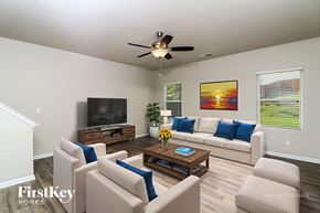 Dallas house for rent - A living room with a television, couch, and coffee table.
