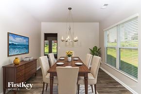 Dallas house for rent - A dining room with a wooden table and chairs.