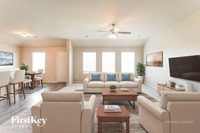 Montevallo house for rent - A living room with a couch, chairs, and a ceiling fan.