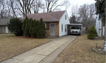 Oak Park house for rent - A house with a garage and a car parked in front.