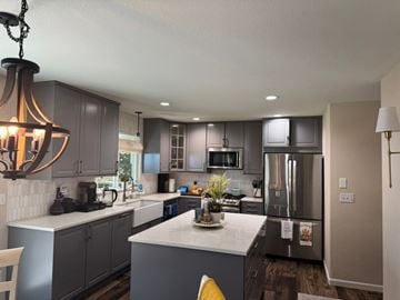 Highlands Ranch house for rent - A modern kitchen with a large island and stainless steel appliances.