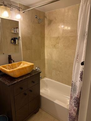 Takoma Park house for rent - A bathroom with a yellow sink and a shower curtain.