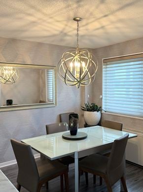 Takoma Park house for rent - A dining room with a white table and grey chairs.
