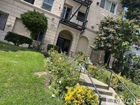 Los Angeles apartment for rent - A building with a balcony and a tree in front of it.