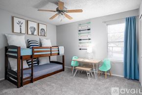 San Antonio apartment for rent - A bedroom with a bunk bed and a desk.