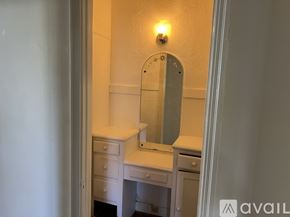 Los Angeles apartment for rent - A bathroom with a sink, mirror, and light switch.