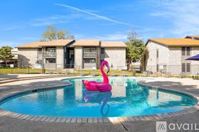 San Antonio apartment for rent - A pool with a pink flamingo float in the middle of it.