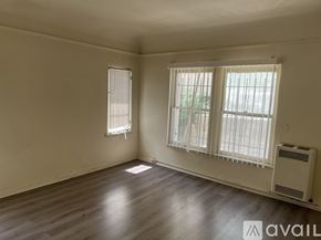 Los Angeles apartment for rent - A room with a window and a wall-mounted air conditioner.