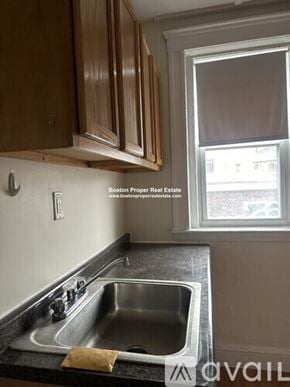 Boston apartment for rent - A kitchen with a sink and a window.