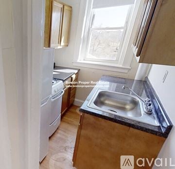 Boston apartment for rent - A kitchen with a sink and a window.