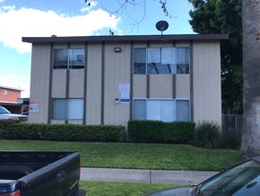 Garden Grove apartment for rent - this is an image of an apartment building with a sign in the window