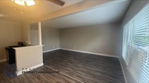 Garden Grove apartment for rent - A room with a wooden floor and a ceiling fan.