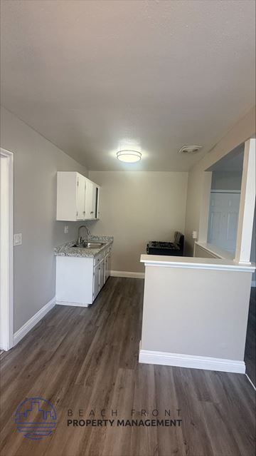 Garden Grove apartment for rent - A kitchen area with a white cabinet and a white countertop.
