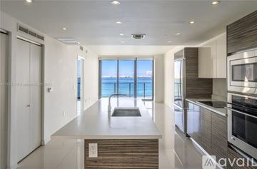 Miami apartment for rent - A modern kitchen with a view of the ocean.