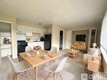 Franklin apartment for rent - A kitchen with a table and chairs in the middle of the room.