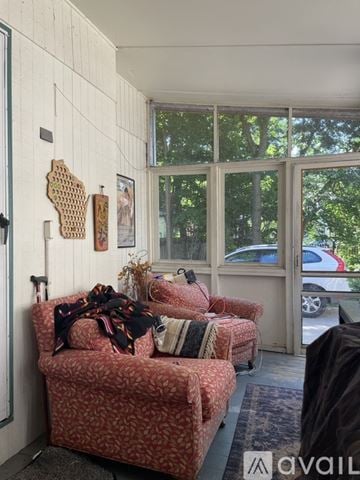 Madison house for rent - A living room with a couch and a rug.