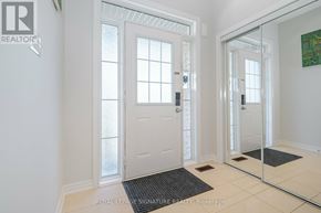 Mississauga (Churchill Meadows) house for rent - A white door with a glass window is in a room with a black mat in front of it.