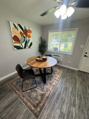 Greensboro apartment for rent - A dining room with a round wooden table and two chairs.