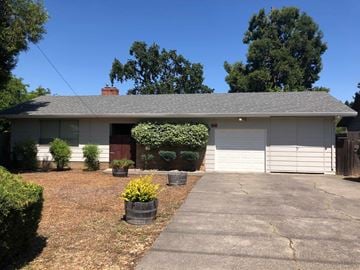 Santa Rosa house for rent - A house with a red door and white garage door.
