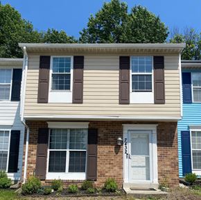 Capitol Heights house for rent - A house with brown and white trim and a white door.