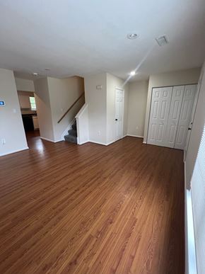 Capitol Heights house for rent - A room with wooden floors and white walls.