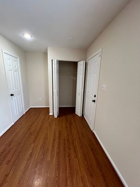 Capitol Heights house for rent - A room with wood flooring and white walls.