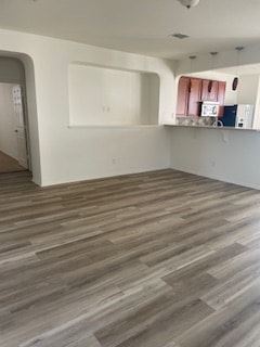 Cedar Park house for rent - A room with a wooden floor and white walls.