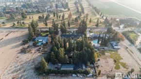 Fresno apartment for rent - A bird's eye view of a residential area with houses and trees.