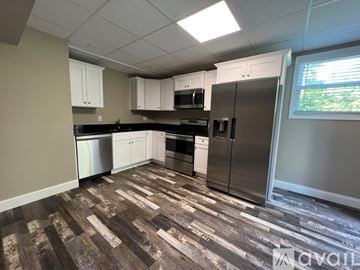 Ringgold house for rent - A kitchen with wood flooring and stainless steel appliances.