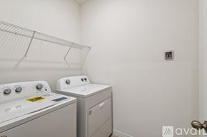 Davenport house for rent - A spacious room with tiled flooring and a sliding glass door leading to a pool area.