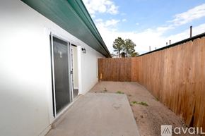 Albuquerque apartment for rent - A room with a door on the left and a green door on the right.