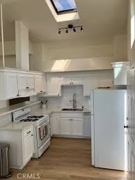 Los Angeles apartment for rent - A kitchen with white appliances and cabinets.
